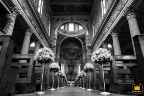 Mantova, Italy - Duomo di Mantova ceremony location documented before the bride and groom arrive. Low-angle black and white architectural shot inside the historic old world stone building.